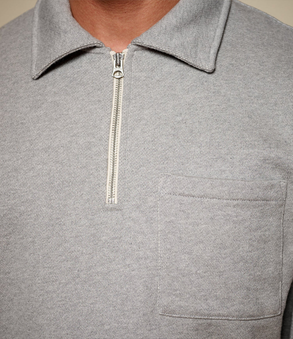 Men's gray half-zip polo sweatshirt with chest pocket