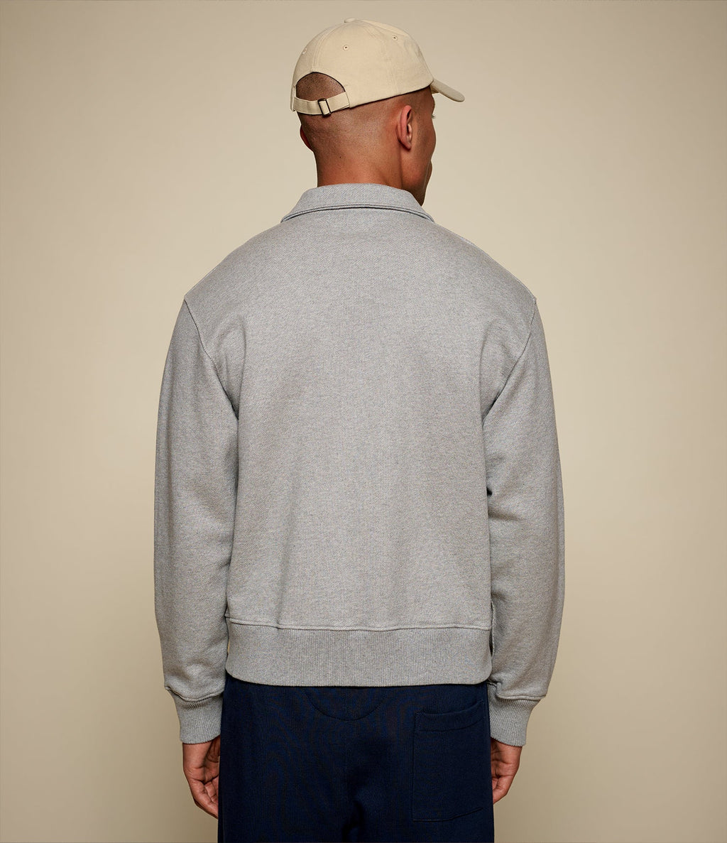 Men's gray half-zip polo sweatshirt with chest pocket