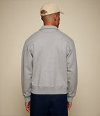 Men's gray half-zip polo sweatshirt with chest pocket
