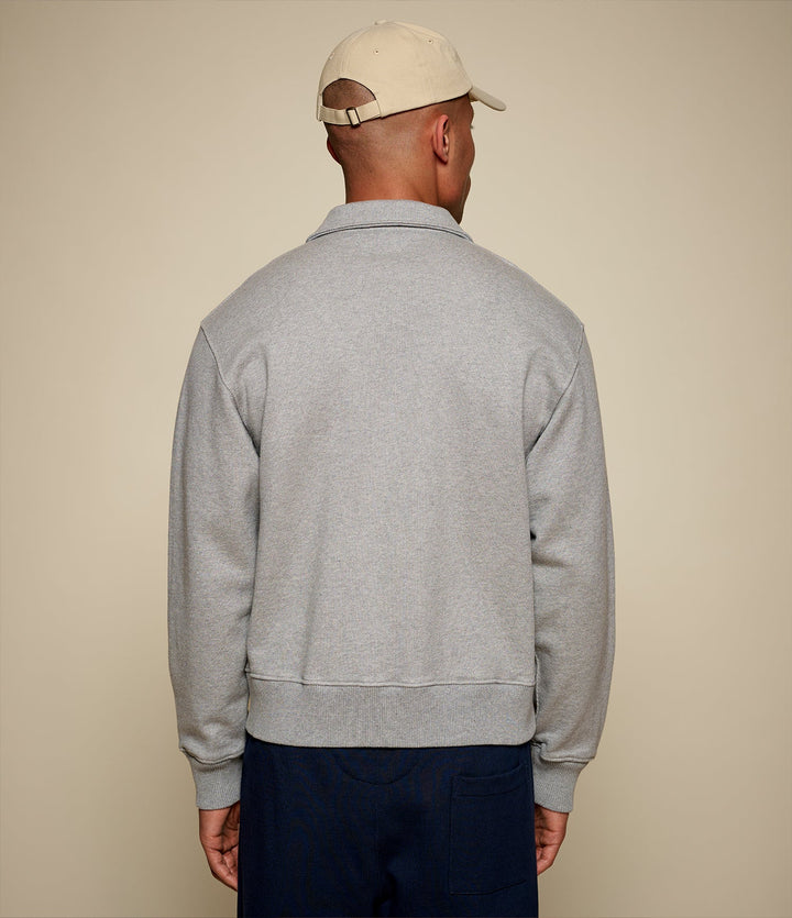 Men's gray half-zip polo sweatshirt with chest pocket
