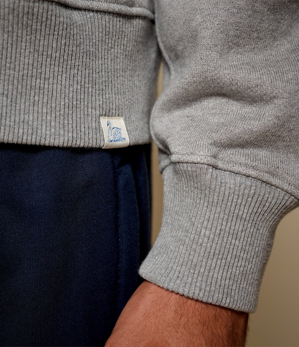 Men's gray half-zip polo sweatshirt with chest pocket