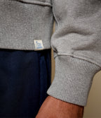 Men's gray half-zip polo sweatshirt with chest pocket