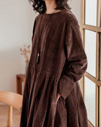 Women's long-sleeve velvety midi dress with a round neckline and full gathered skirt