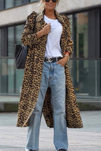 Woman wearing a leopard print long sleeve midi trench coat