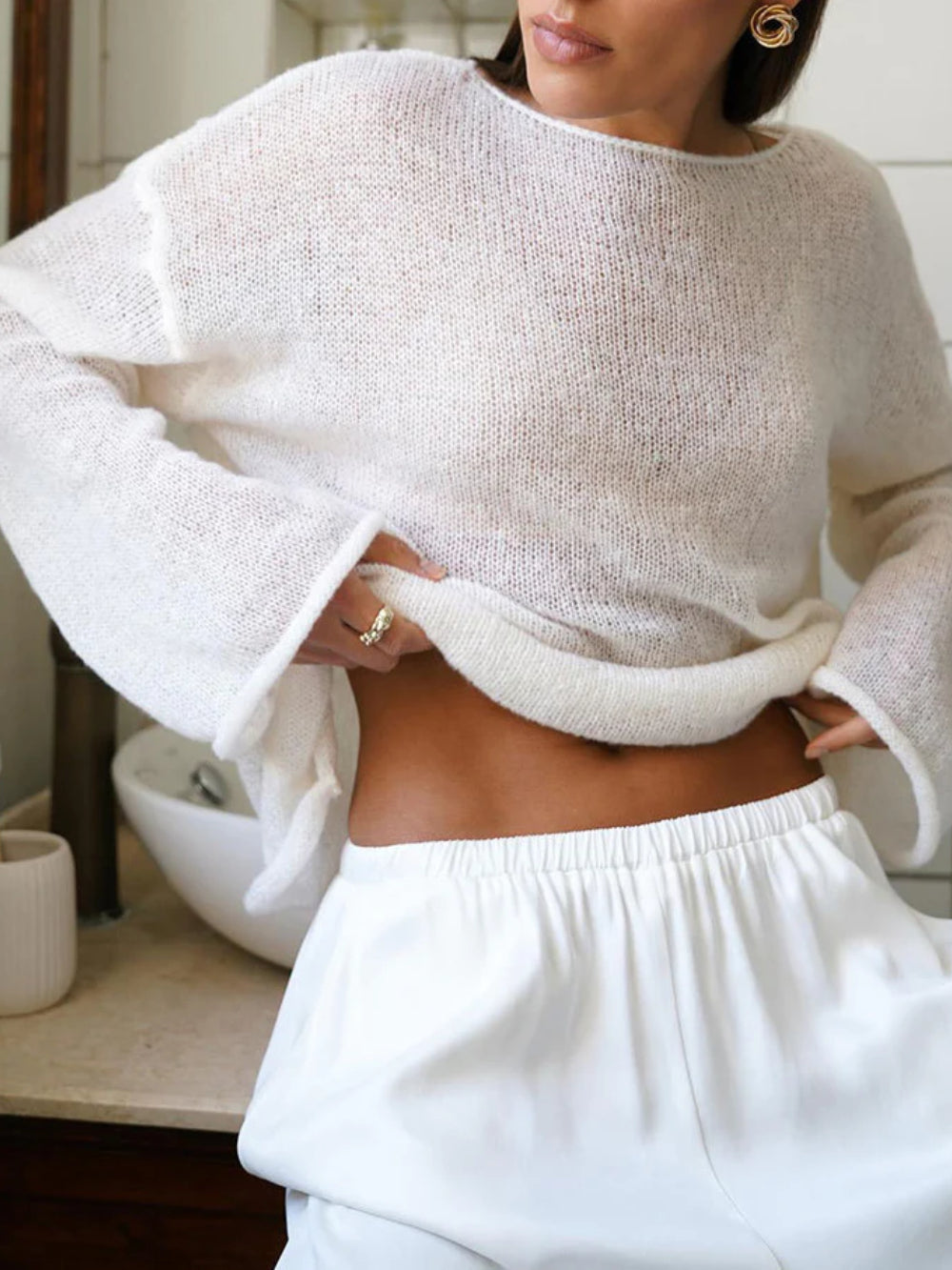 Women's open-knit oversized sweater with wide sleeves and crew neck
