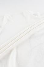 White waffle sweatshirt with black script graphic and long sleeves