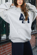 Women's oversized pullover hoodie with number graphic and kangaroo pocket
