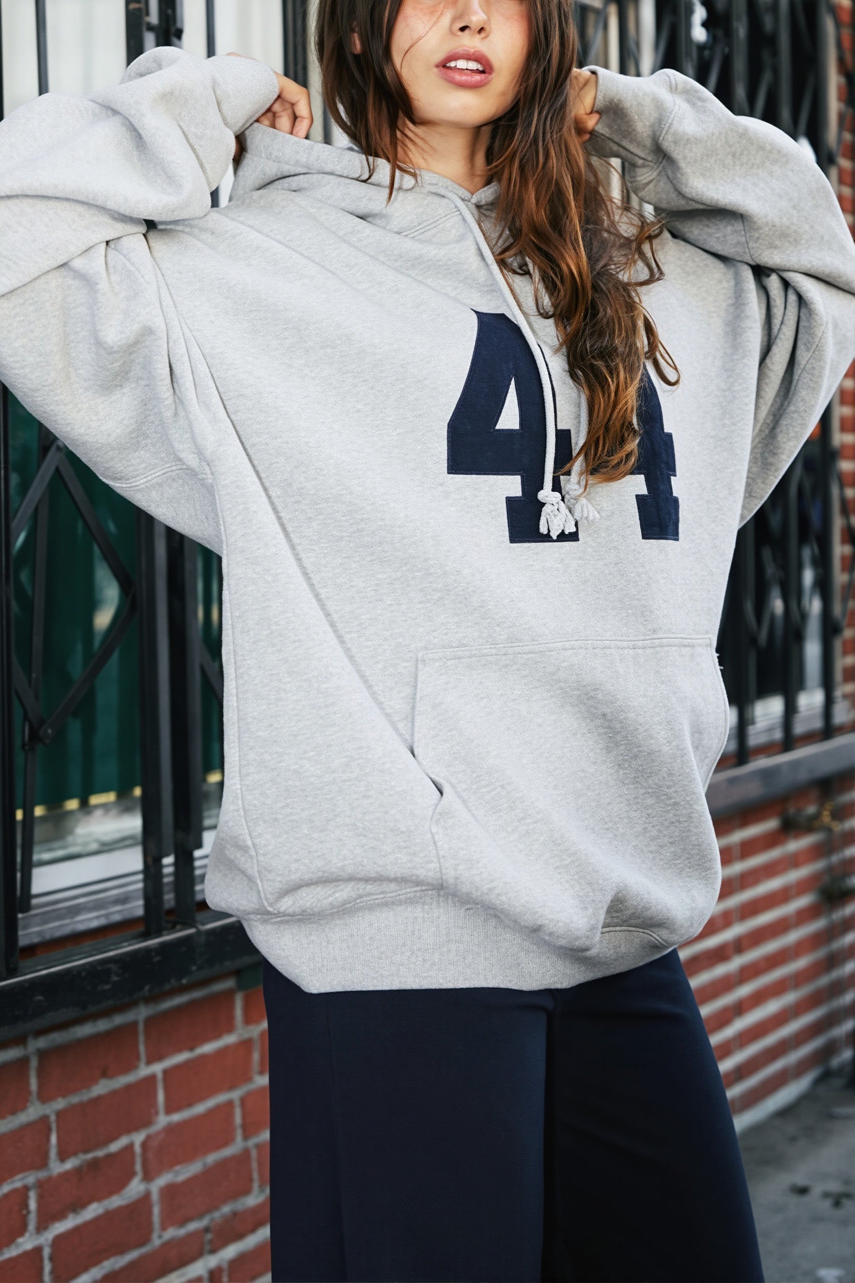 Women's oversized pullover hoodie with number graphic and kangaroo pocket