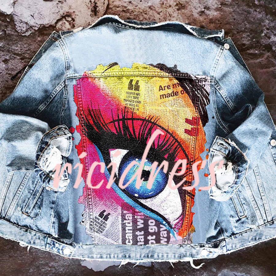 Women's denim jacket with colourful graphic eye print on the back