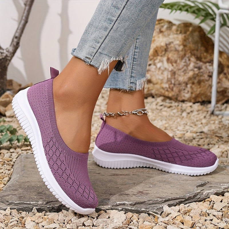 Women's knitted slip-on shoes with closed rounded toe and white ridged sole