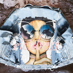 Women's printed denim jacket with portrait graphic and distressed details