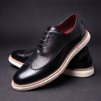 Textured lace-up Oxford shoes with rounded toes and contrasting layered soles