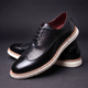 Textured lace-up Oxford shoes with rounded toes and contrasting layered soles