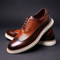 Textured lace-up Oxford shoes with rounded toes and contrasting layered soles