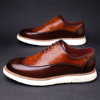 Textured lace-up Oxford shoes with rounded toes and contrasting layered soles