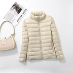 Women's quilted puffer jacket with high collar, long sleeves and front zip