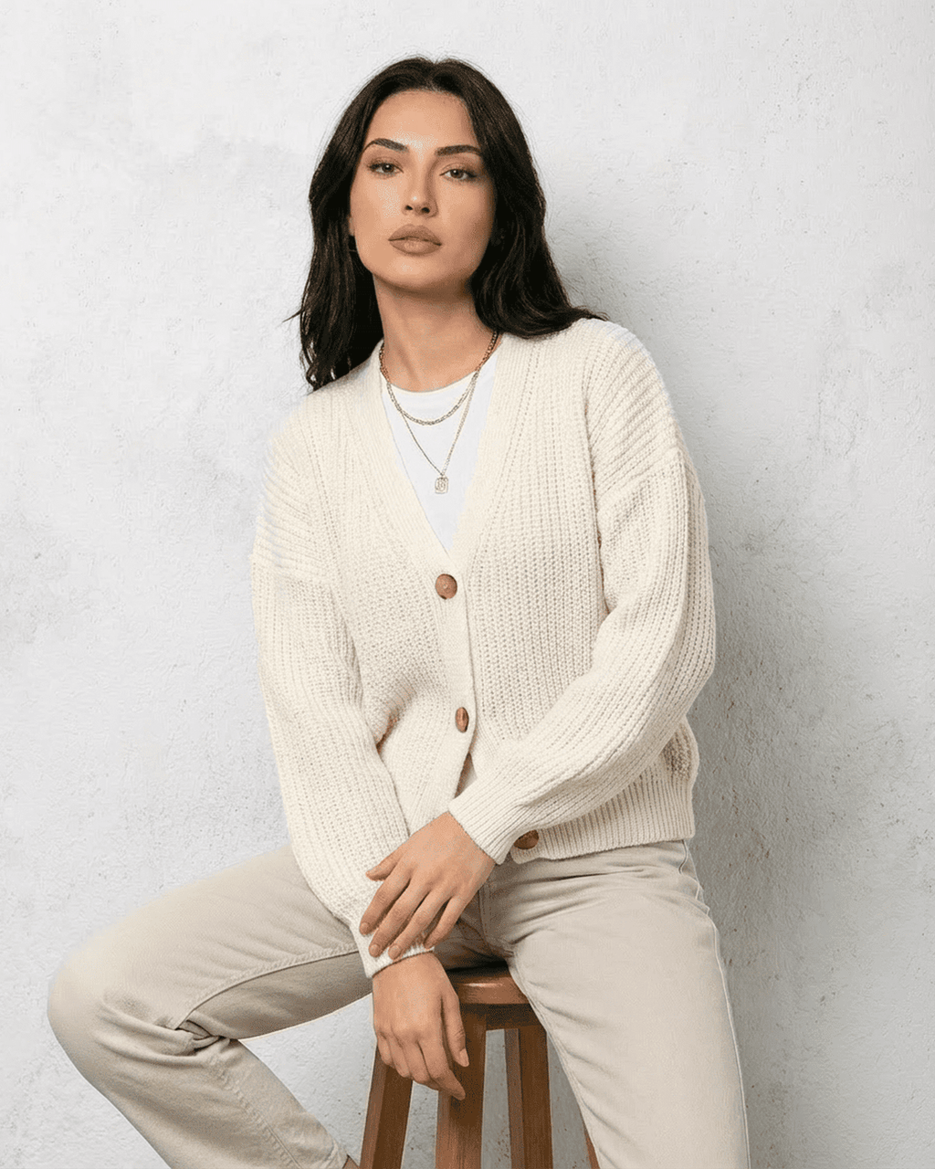 Women's white V-neck knit cardigan with button front