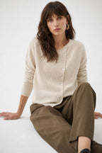 Women's button front cardigan with long sleeves and front pockets