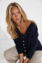 Women's button front cardigan with long sleeves and front pockets