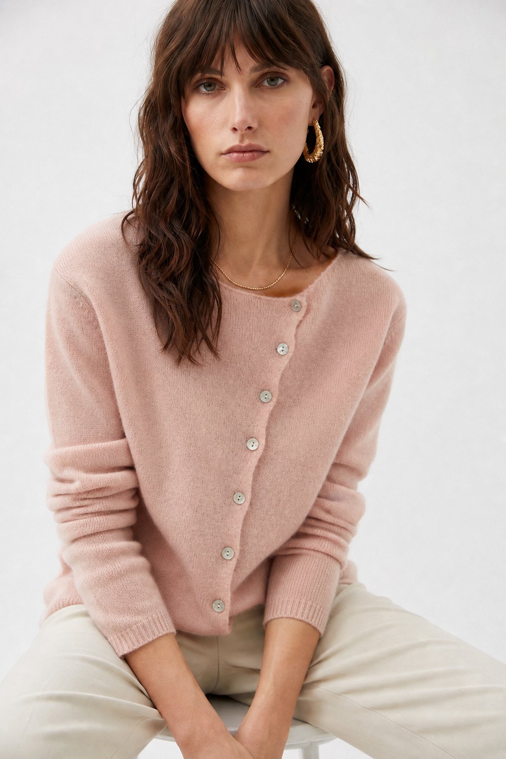 Women's button front cardigan with long sleeves and front pockets