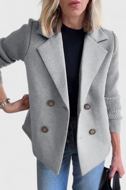 Women's short double-breasted coat with lapels and ribbed knitted sleeves