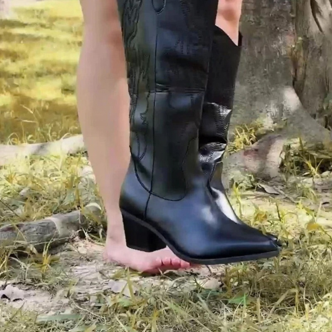 Black women's knee-high western boots with stitched panels and block heels