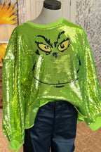 Women's bright green Grinch face sequin jumper with long sleeves