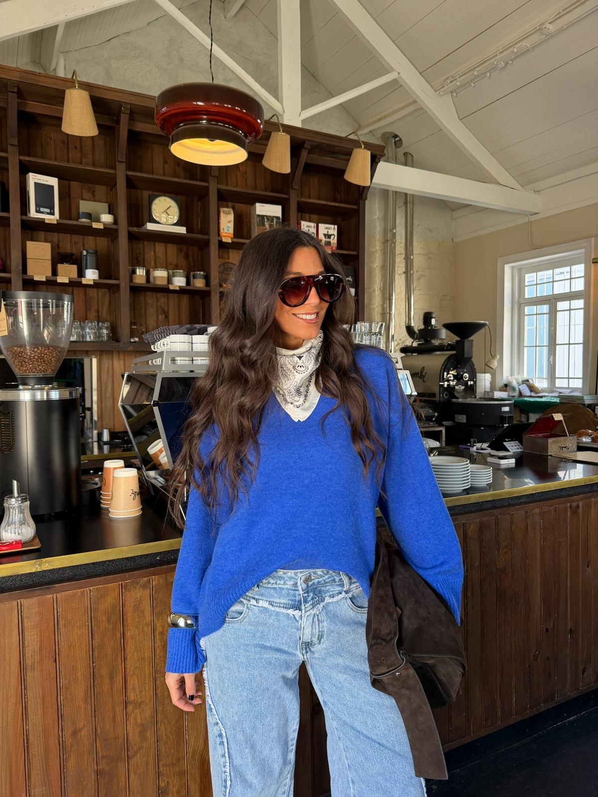 Women's royal blue V-neck sweater with long sleeves and ribbed trims