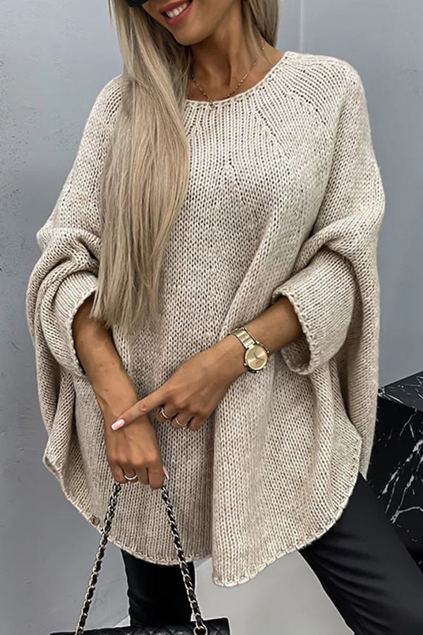Women's loose knit poncho sweater with crew neckline and wide sleeves