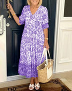 Women's floral V-neck midi dress with three-quarter sleeves