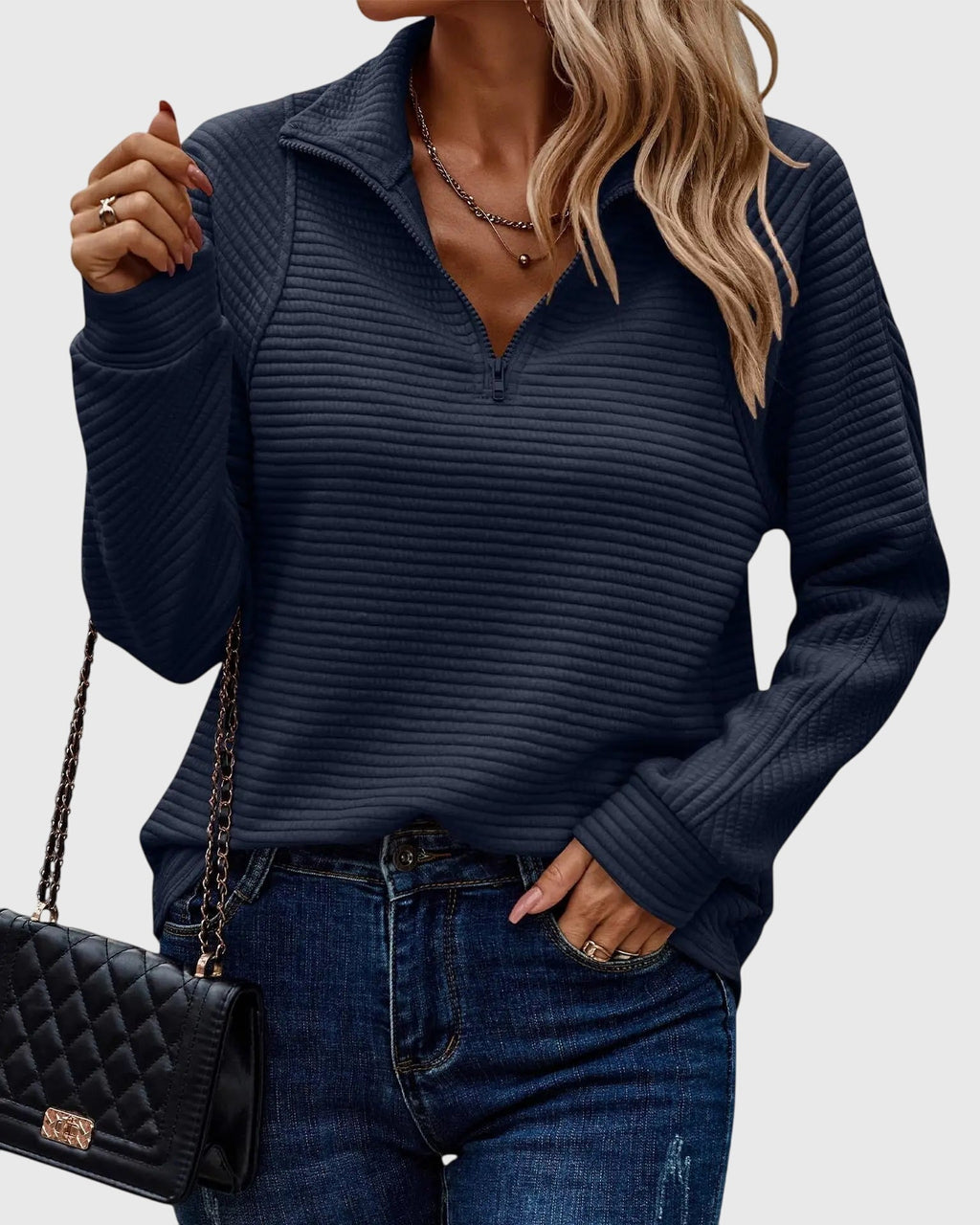 Women's ribbed quarter-zip sweater with collar and long sleeves