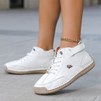 Ankle-height lace-up sneakers with stitched panels, ankle straps and contrast soles