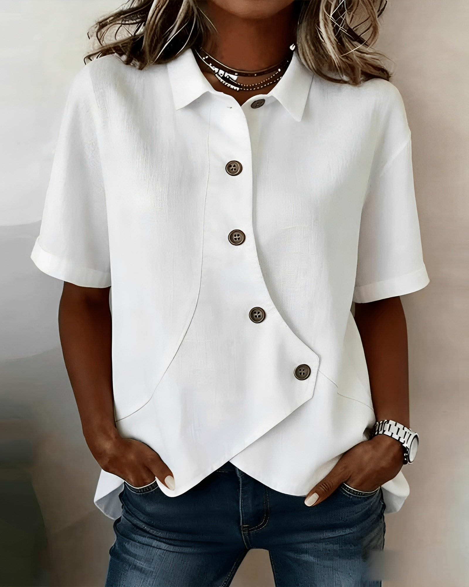 Women's short-sleeve button blouse with pointed collar and curved hem