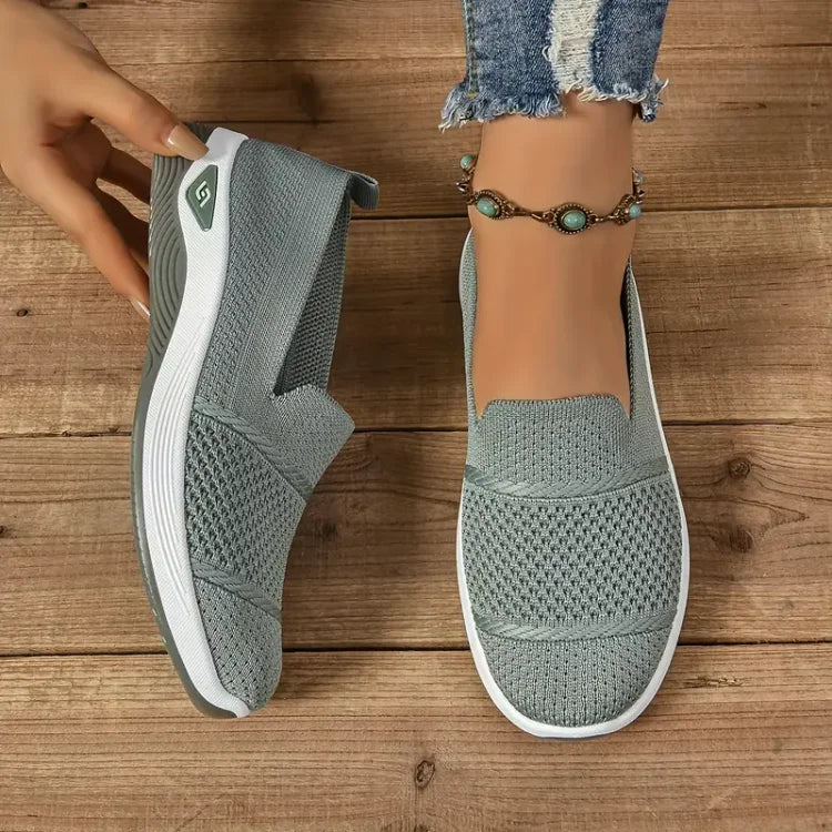 Women's knit slip-on sneakers with textured panels and white soles
