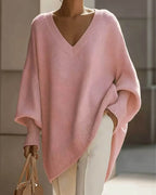 Women's oversized V-neck jumper with batwing sleeves and asymmetric hem