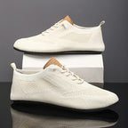 Knit sneakers with lace-up fronts, round toes and pull tabs