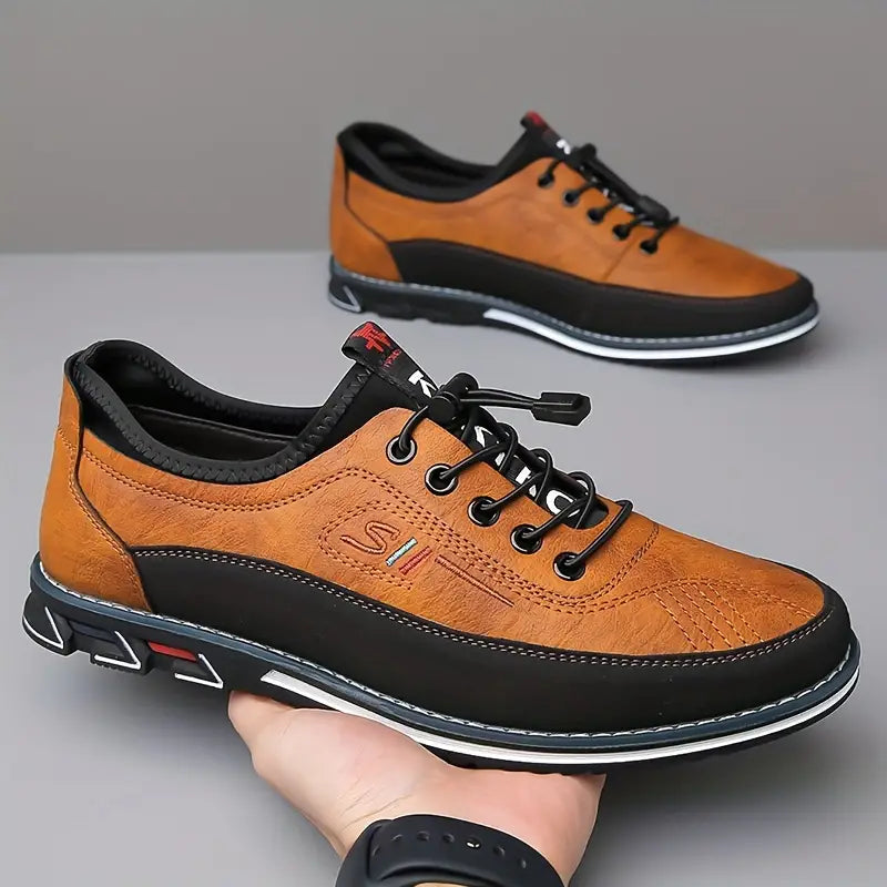 Men's lace-up Oxford-style shoes with contrasting panels and flat patterned soles