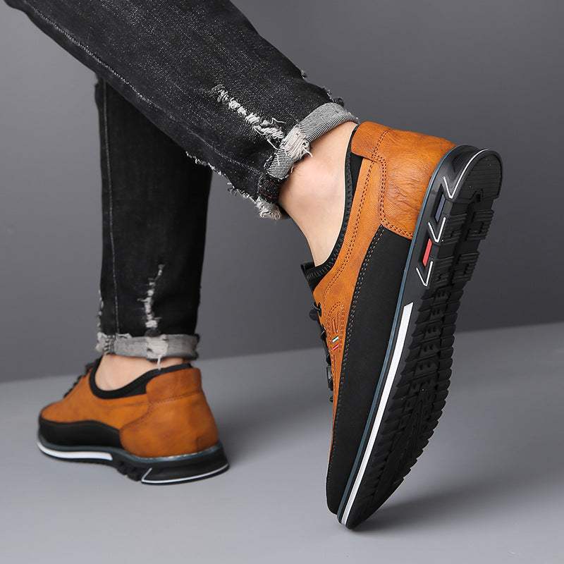 Men's lace-up Oxford-style shoes with contrasting panels and flat patterned soles