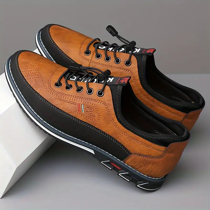 Men's lace-up Oxford-style shoes with contrasting panels and flat patterned soles