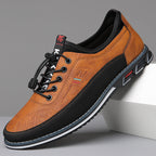 Men's lace-up Oxford-style shoes with contrasting panels and flat patterned soles