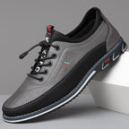 Men's lace-up Oxford-style shoes with contrasting panels and flat patterned soles