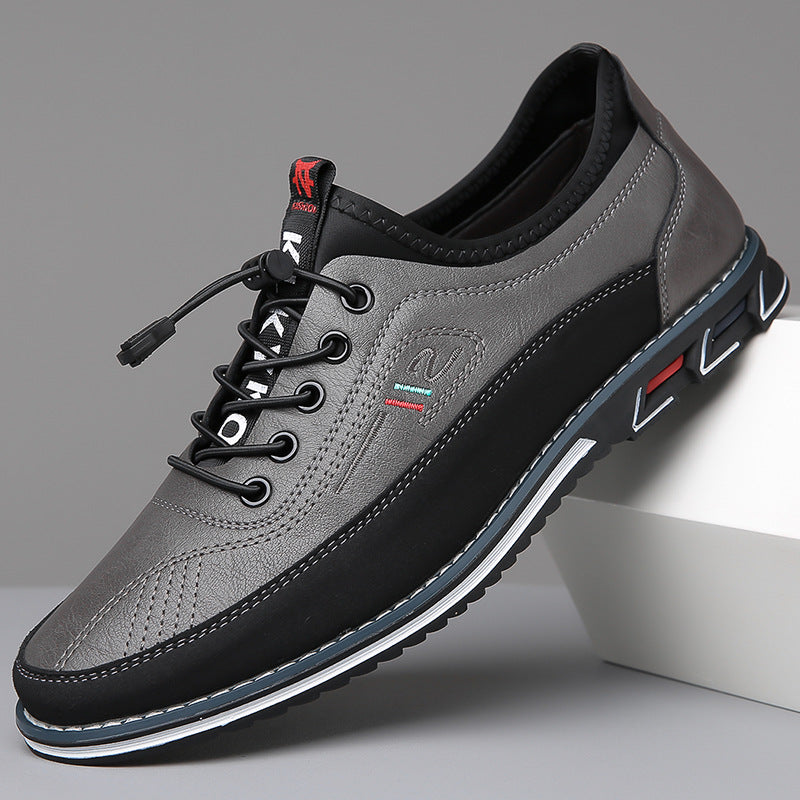 Men's lace-up Oxford-style shoes with contrasting panels and flat patterned soles