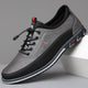 Men's lace-up Oxford-style shoes with contrasting panels and flat patterned soles