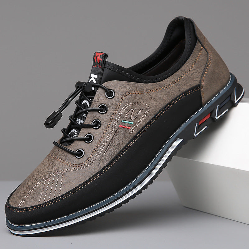 Men's lace-up Oxford-style shoes with contrasting panels and flat patterned soles