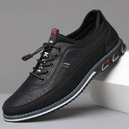 Men's lace-up Oxford-style shoes with contrasting panels and flat patterned soles