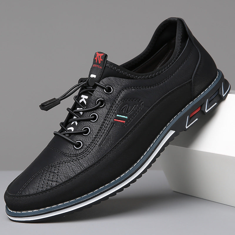 Men's lace-up Oxford-style shoes with contrasting panels and flat patterned soles