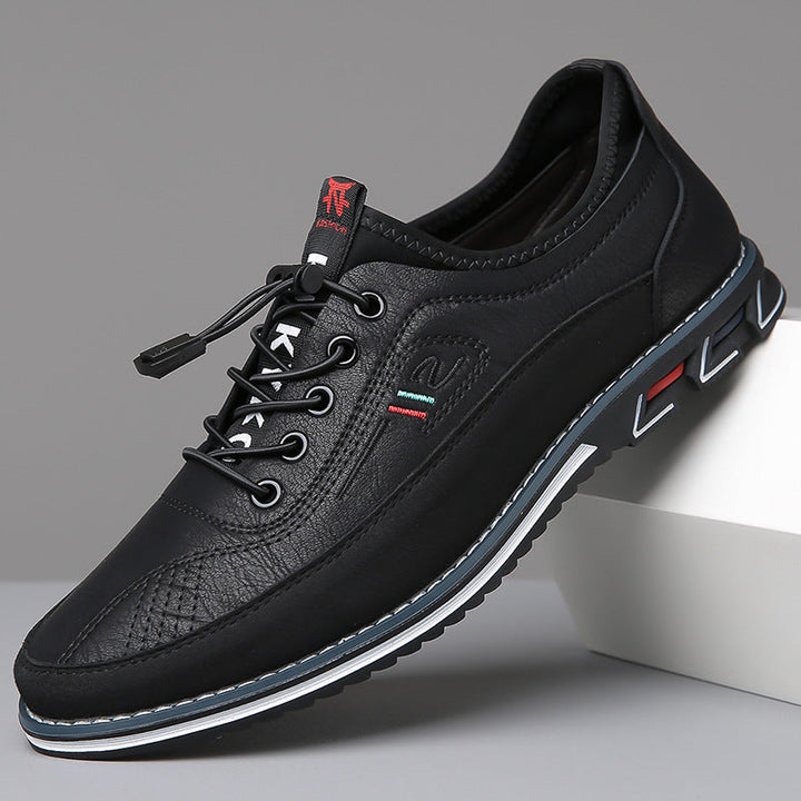 Men's lace-up Oxford-style shoes with contrasting panels and flat patterned soles