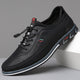 Men's lace-up Oxford-style shoes with contrasting panels and flat patterned soles