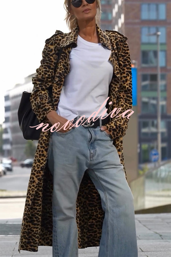 Woman wearing a leopard print long sleeve midi trench coat