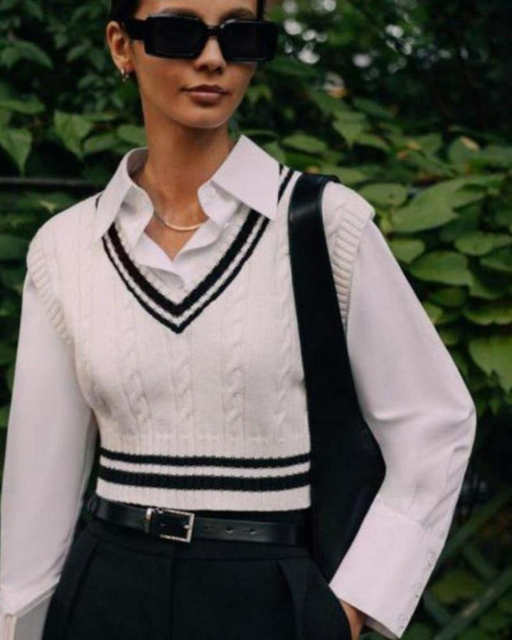 Women's white cable knit sweater vest with V-neck and striped trim